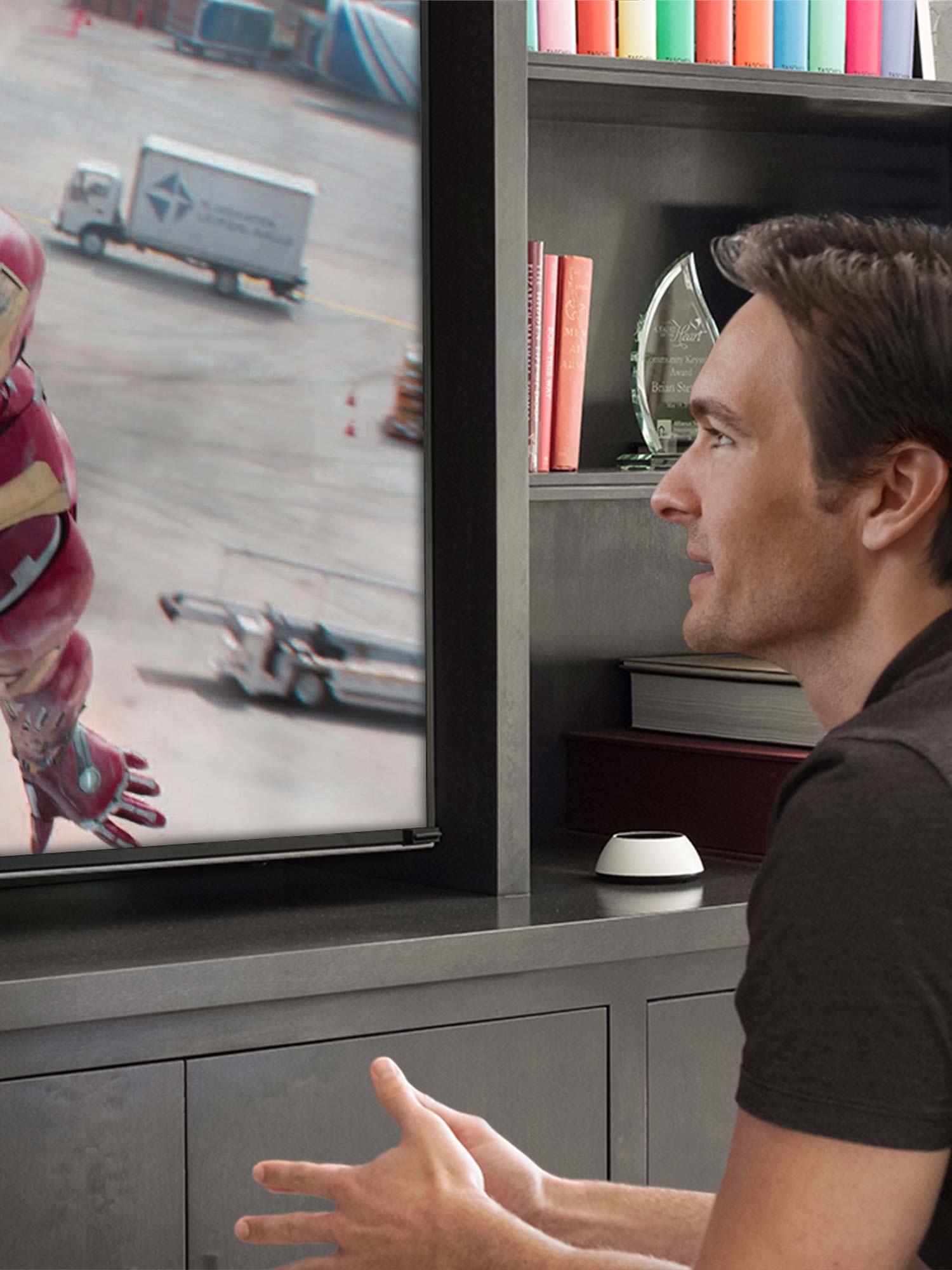 Man using Josh ai technology to change the channels