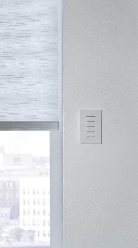 White lutron touchpanel on a white wall